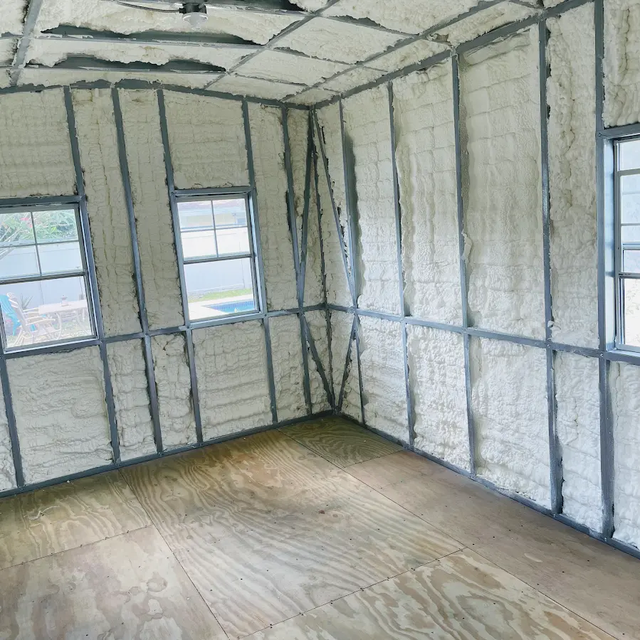 Closed-cell spray foam insulation applied to wall cavities in a residential project in Boonville